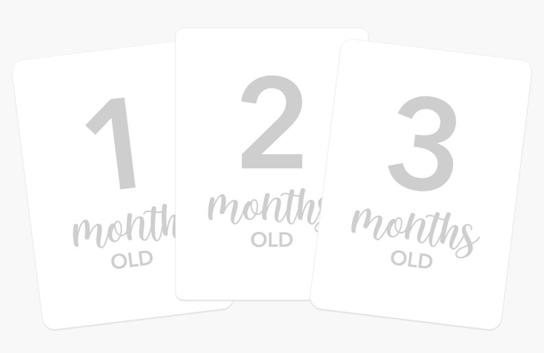 May include: Three white cards with gray numbers and text. The cards show "1 month old", "2 months old", and "3 months old".