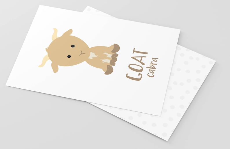 May include: A brown and white cartoon goat with the word "GOAT" and the word "cabra" written below it in brown text.