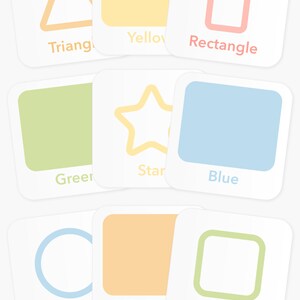 May include: Nine colorful cards with different shapes and colors. The shapes are a triangle, rectangle, star, circle, and square. The colors are yellow, green, blue, orange, and light blue.