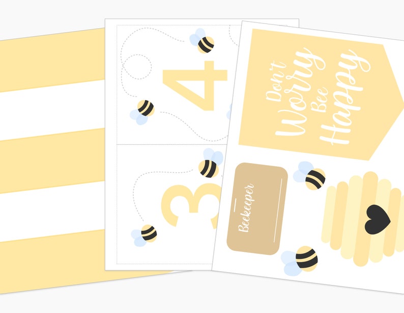 Flat lay of bee keeper pretend play materials, including flower matching cards, printable honeycombs, and a pretend play bee hive.