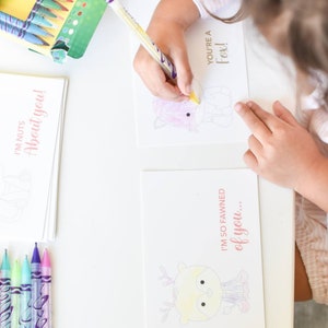 May include: A set of printable Valentine's Day cards featuring cute fox illustrations and puns. The cards are designed to be colored in by children. The text on the cards reads "I'm nuts about you!" and "I'm so fawned of you... You're a fox!"