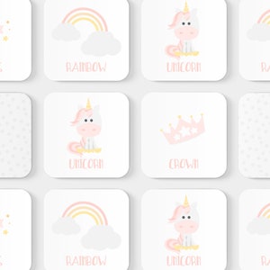 May include: A set of nine colorful learning magnets featuring a unicorn, crown, and rainbow. The magnets are designed for children and feature a playful, whimsical style.