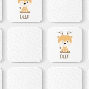 May include: Nine white cards with a dotted pattern.  Four cards feature a cartoon deer illustration with the word "DEER" printed below.  The remaining five cards are blank.