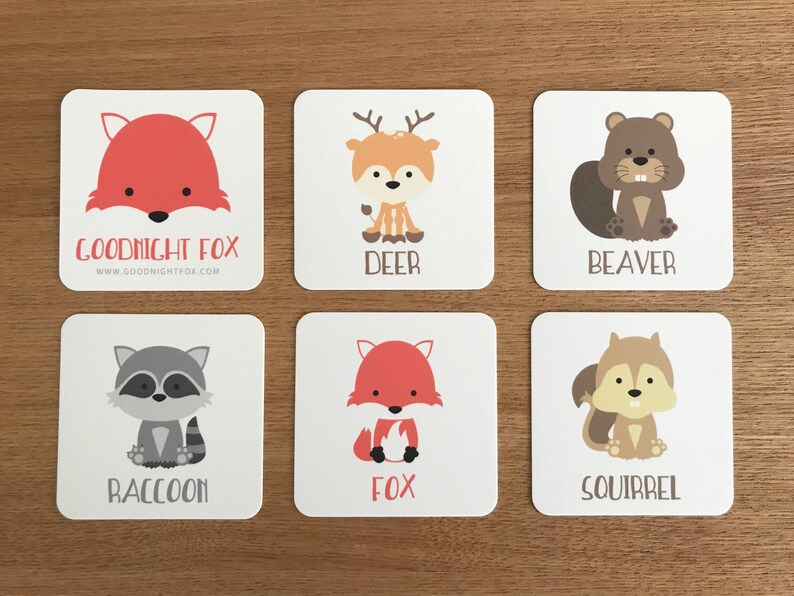 May include: Six colorful cards with illustrations of animals, including a fox, deer, beaver, raccoon, squirrel, and another fox. Each card has the name of the animal printed in black text below the illustration. The top card has the text "Goodnight Fox" and a website address.