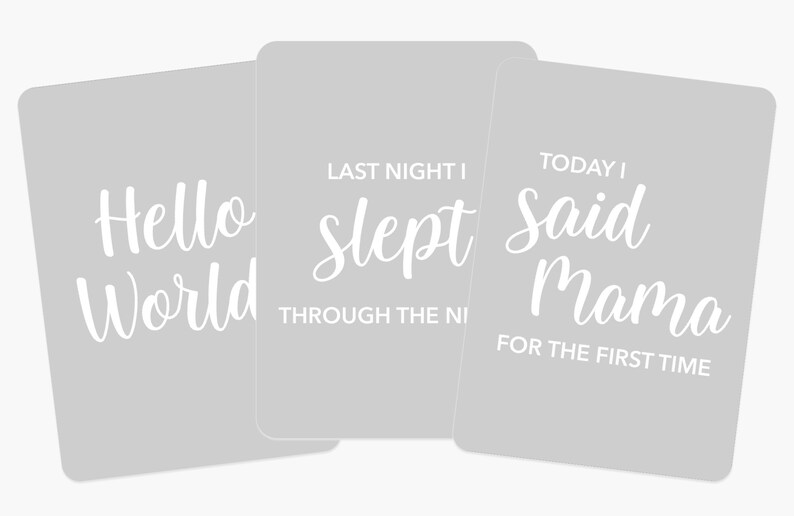 May include: Three gray cards with white text. The first card says "Hello World". The second card says "Last night I slept through the night". The third card says "Today I said Mama for the first time".