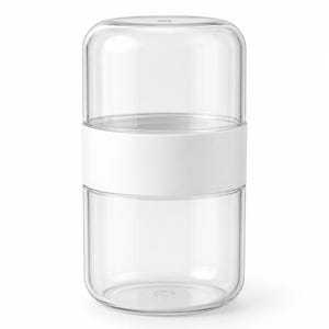 Pode incluir: Um recipiente cilíndrico de vidro transparente com uma larga faixa branca opaca ao redor do centro. O objeto consiste em duas seções de vidro empilháveis com bordas arredondadas, unidas pelo anel branco central, criando uma unidade.