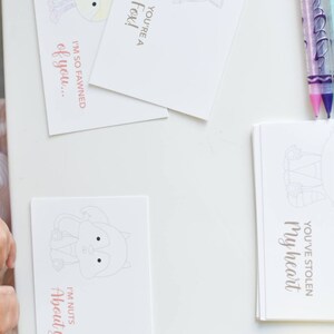 May include: A set of printable Valentine's Day cards featuring cute animal illustrations and puns. The cards are blank inside for writing a message. The text on the cards includes "You're a Fox!" "I'm so fawned of you..." "I'm nuts about you!" and "You've stolen my heart."