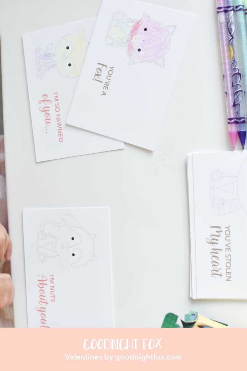 May include: A set of printable Valentine's Day cards featuring cute animal illustrations and puns. The cards are blank inside for writing a message. The text on the cards includes "You're a Fox!" "I'm so fawned of you..." "I'm nuts about you!" and "You've stolen my heart."