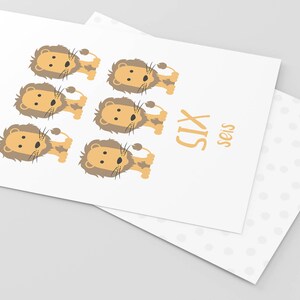 May include: A white card with six cartoon lions in orange and brown. The card says "SIX" in orange letters and "seis" in smaller orange letters.