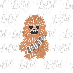 Könnte beinhalten: Ein brauner Ausstecher in Form von Chewbacca aus Star Wars. Der Ausstecher hat ein detailliertes Design mit Fellstruktur, einem Bandolier und Gesichtszügen. Der Ausstecher ist mit einer dunkleren braunen Farbe umrandet.
