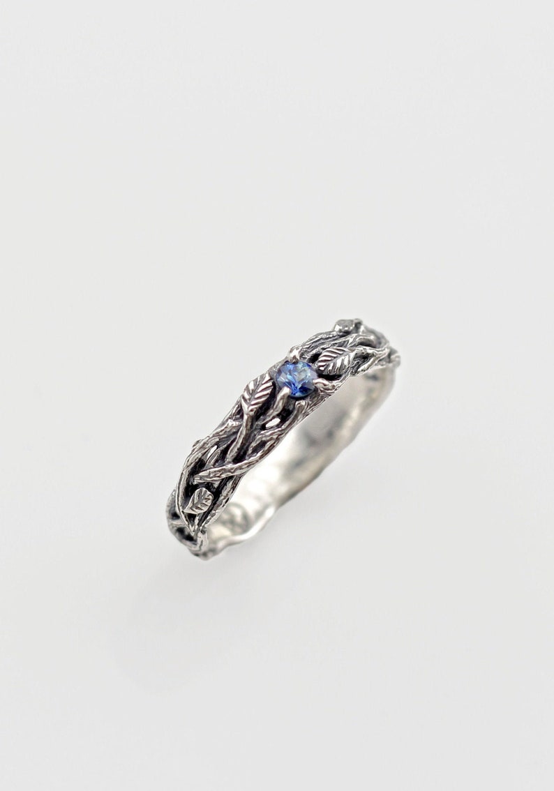 ring made of silver branches with leaves and sapphire. Gift for a woman