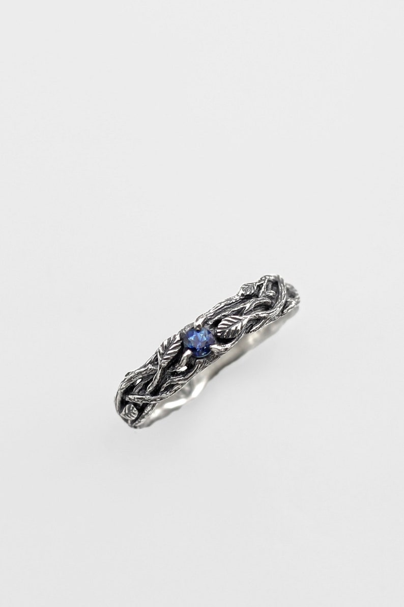 ring made of silver branches with leaves and sapphire. Gift for a woman