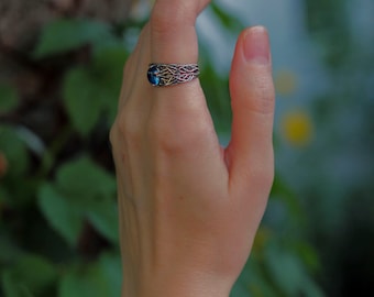 Wicker silver ring with topaz.