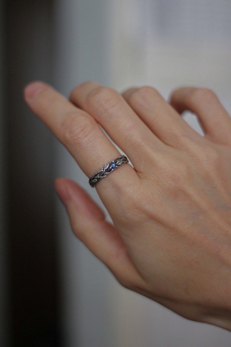 ring made of silver branches with leaves and sapphire. Gift for a woman