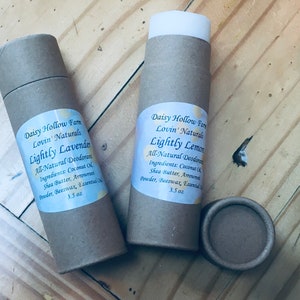 May include: Two brown cardboard tubes with white labels. The labels read "Daisy Hollow Farm Lovin' Naturals Lightly Lavender All-Natural Deodorant 3.5 oz" and "Daisy Hollow Farm Lovin' Naturals Lightly Lemon All-Natural Deodorant 3.5 oz".