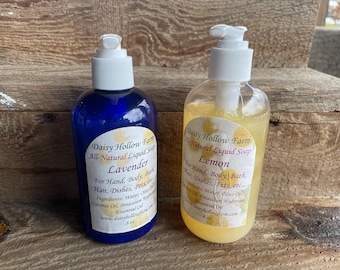May include: Two 8-ounce bottles of all-natural liquid soap, one lavender and one lemon. The bottles are clear with white pump tops and labels that say "Daisy Hollow Farm".