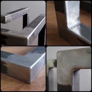 K&ouml;nnte beinhalten: Nahaufnahme von vier Tischbeinen aus Metall mit Schwei&szlig;n&auml;hten. Die Beine sind aus silberfarbenem Metall und haben eine rechteckige Form.