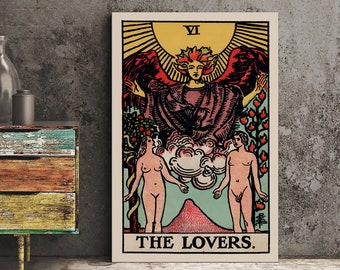 May include: A framed tarot card print featuring "The Lovers" card. The artwork depicts a winged figure above two nude figures, with a mountain and sun in the background. The color palette includes red, yellow, and green.