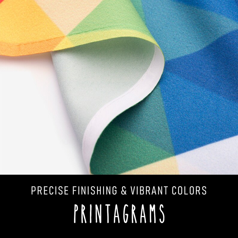 May include: Close-up of a colorful fabric with a white border. The fabric has a geometric pattern with vibrant colors, including red, orange, yellow, green, blue, and purple. The text "PRECISE FINISHING & VIBRANT COLORS PRINTAGRAMS" is visible at the bottom of the image.