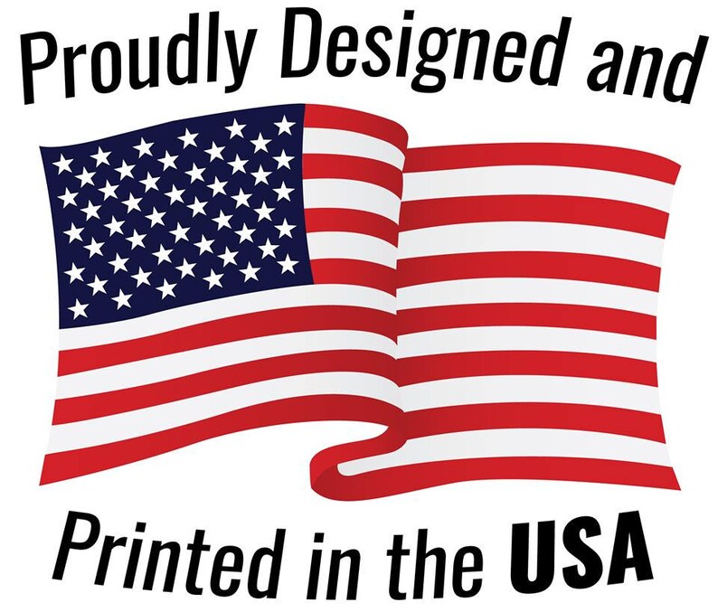 May include: A red, white, and blue American flag waving in the wind. The text "Proudly Designed and Printed in the USA" is below the flag.