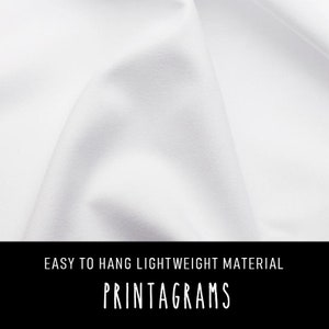 May include: White fabric with a smooth texture. The fabric is lightweight and easy to hang. The text "EASY TO HANG LIGHTWEIGHT MATERIAL PRINTAGRAMS" is printed on the bottom of the image.