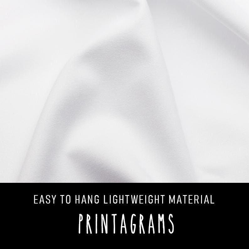 May include: White fabric with a smooth texture. The fabric is lightweight and easy to hang. The text "EASY TO HANG LIGHTWEIGHT MATERIAL PRINTAGRAMS" is printed on the bottom of the image.