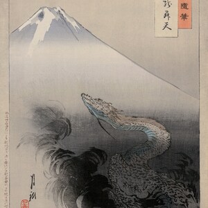May include: A woodblock print depicting Mount Fuji in the background with a dragon rising from the clouds in the foreground. The print is titled "月 酔 醒" in Japanese characters.