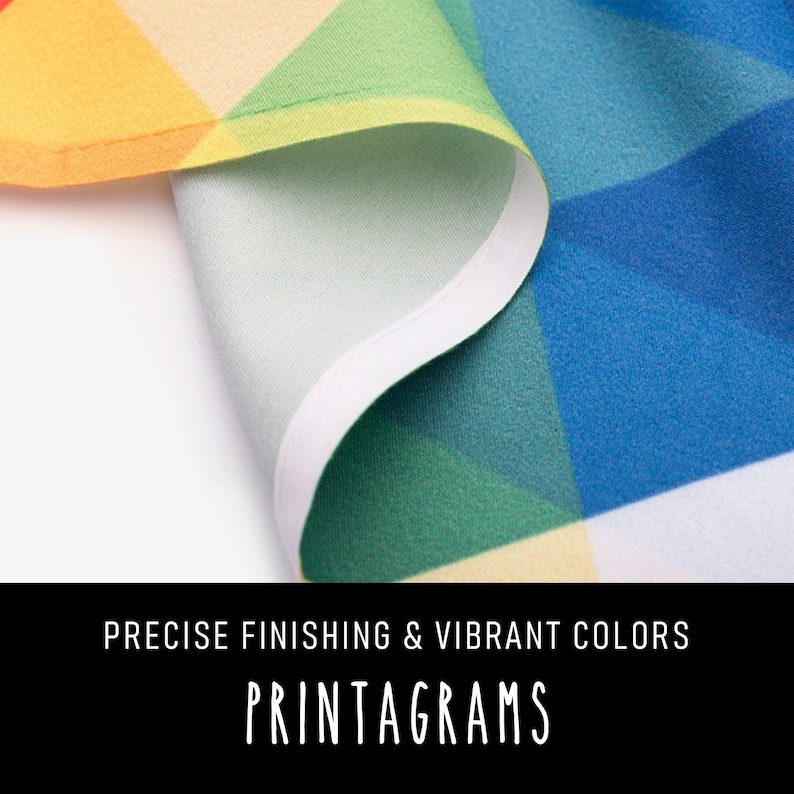 May include: Close-up of a colorful fabric with a white border. The fabric has a geometric pattern with vibrant colors, including red, orange, yellow, green, blue, and purple. The text "PRECISE FINISHING & VIBRANT COLORS PRINTAGRAMS" is visible at the bottom of the image.