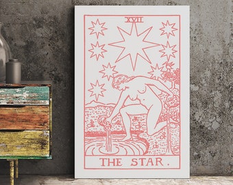 May include: A rectangular wall art print featuring a pink line drawing of The Star tarot card on a white background. The illustration depicts a figure kneeling by a pool of water, pouring liquid from two vessels under a large star and seven smaller stars.