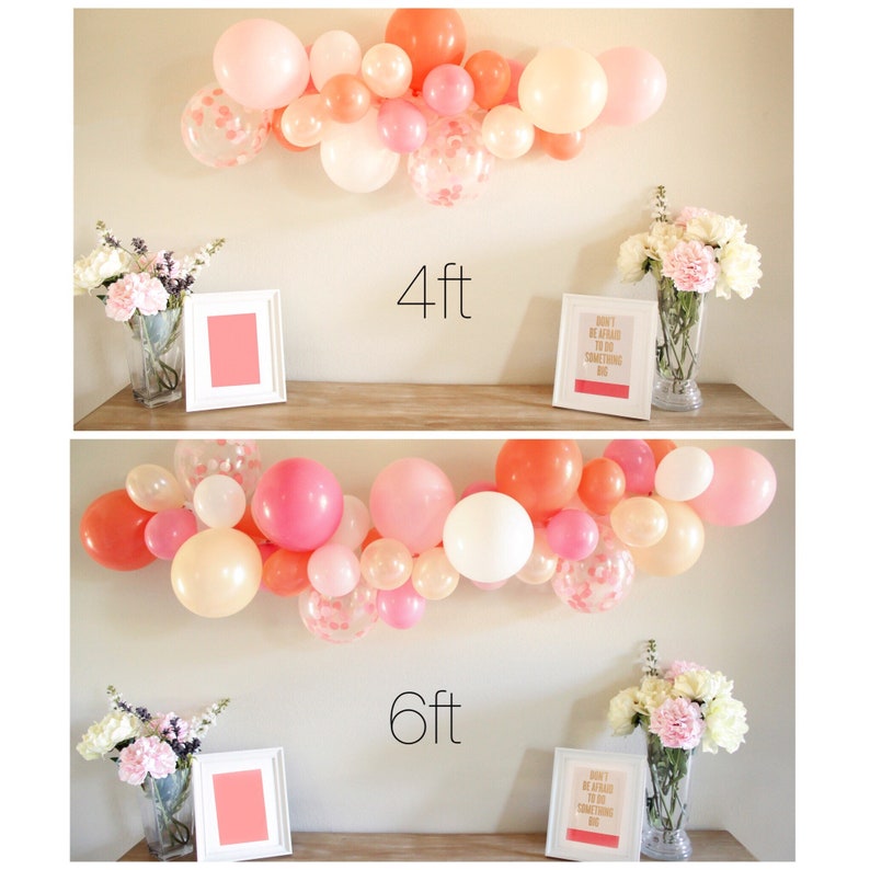 A size example shows a 4 foot and 6 foot balloon garland made up of coral, pearl peach, rose, white, and matching confetti filled balloons sitting above a 6 foot table for comparison.