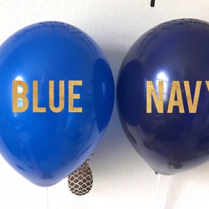 A blue and navy balloon next to each other for color comparison. The navy is darker.