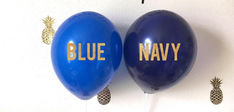 A blue and navy balloon next to each other for color comparison. The navy is darker.