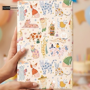 May include: A wrapped gift featuring a whimsical pattern of cartoon cats in various outfits and poses. The cats are in different colors and patterns, with some wearing hats, costumes, and accessories. The background is a light beige with scattered stars.