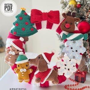 May include: A crochet Christmas wreath featuring red and white stripes, adorned with a large red bow, a green tree, a brown reindeer, a candy, two snowflakes, two gingerbread figures, and a brown dachshund wearing a red Santa hat and coat.