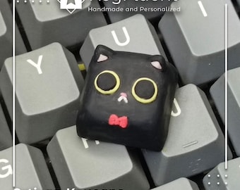 Tecla artesanal inspirada en un gato