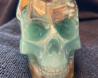 Beach themed skull with shells, sand and ocean blue colors.