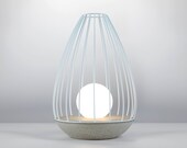 OVA Table Lamp series Model Flame/ Concrete and cage lamp