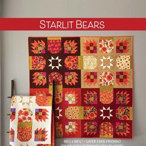 May include: A quilt pattern for a quilt featuring a bear paw design with a star in the centre. The quilt is made in shades of orange, red, brown, and white. The quilt is 60 1/2 inches by 60 1/2 inches and is layer cake friendly. The text "STARLIT BEARS" is at the top of the image. The text "60 1/2 x 60 1/2" LAYER CAKE-FRIENDLY" is in the centre of the image. The text "Use one or four background colours for variety!" is below the text "60 1/2 x 60 1/2" LAYER CAKE-FRIENDLY". The text "ROBIN PICKENS QUILT PATTERNS" is at the bottom of the image.
