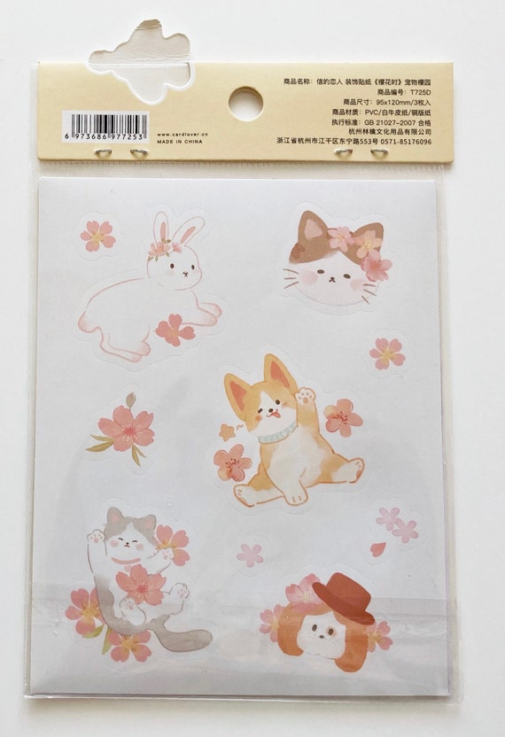beau carnet avec de dessin de chats mignons sous les fleurs de sakura