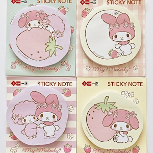 May include: Four pink and yellow sticky note pads featuring My Melody, a popular Sanrio character, with strawberry and flower designs. Each pad has the text "My Melody" and "Sticky Note" printed on it.