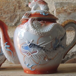 Serving part has coffee, tea, with sake bottle in fine porcelain Japanese eggshell Kutani geisha dragons xx era