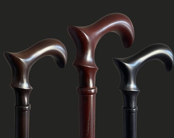 May include: Three wooden walking canes with different colored finishes. The canes have a curved handle and a smooth, polished finish.