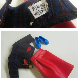 May include: A blue and red plaid jacket with a red skirt and blue shoes. The jacket has a label that says "Tammy" and "Ideal".
