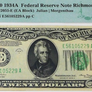 May include: A 1934A $20 Federal Reserve Note from Richmond, graded 63 Choice Uncirculated. The note features a portrait of Andrew Jackson and the text "Twenty Dollars". Encased in a protective holder with PMG certification.