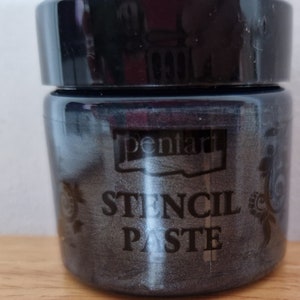 May include: A black jar of stencil paste with the brand name "Pentart" and the words "Stencil Paste" printed on the label.