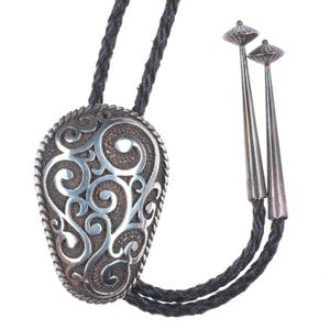 1991 Chambers Sterling Silver southwestern scrollwork bolo tie
