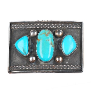 Vintage Navajo sterling silver belt buckle with three turquoise