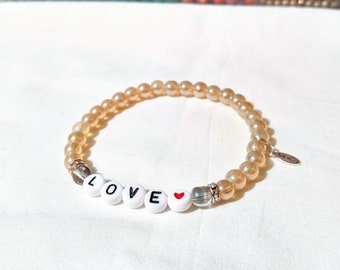 Love Beaded Bracelet: Champagne Glass Beads, Heart Accent