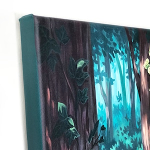 May include: Close-up of a painting depicting a forest scene with dark green trees and a blue-green background. The painting is on a canvas with a teal-colored frame.