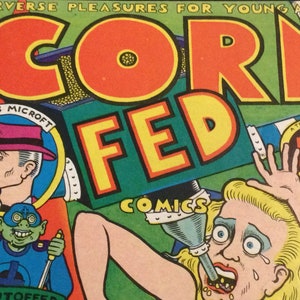 May include: Vintage comic book cover with the title "CORN FED" in large orange letters. The cover features illustrations of characters, including a man in a pink hat and a distressed woman. Text includes "COMICS" and "A TERRIFIC BUY AT 50".